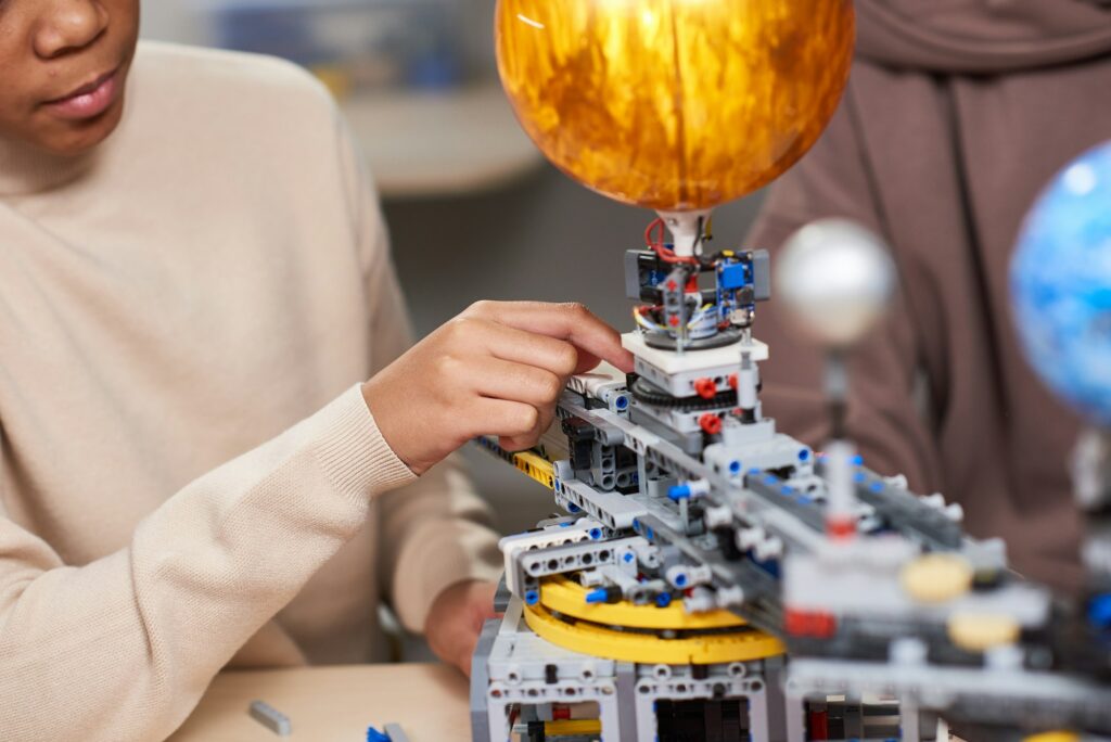 Student working with robot for science project